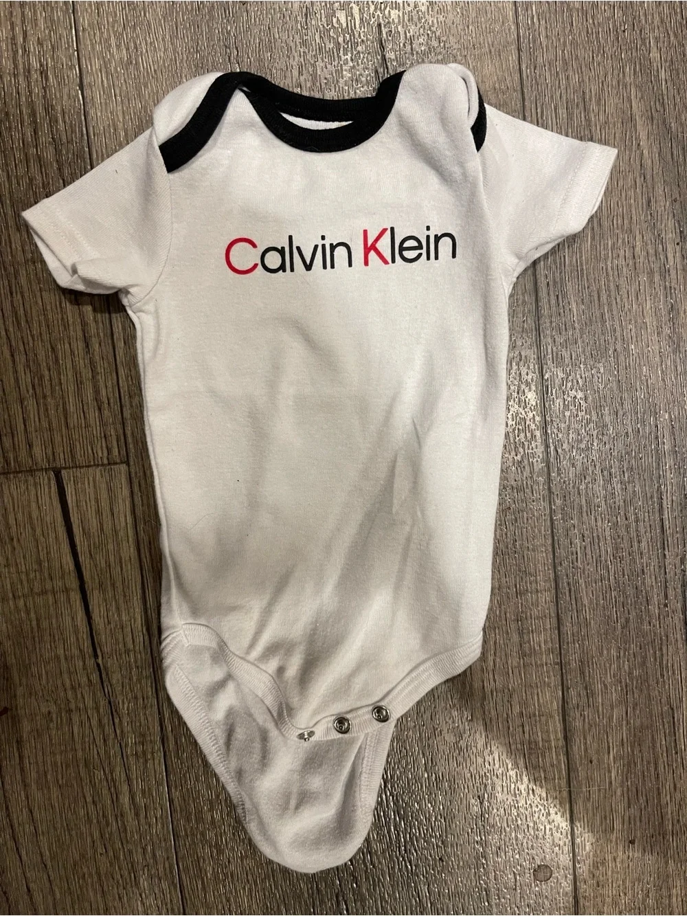Calvin Klein White Baby One-Piece with Black Trim and Red Logo